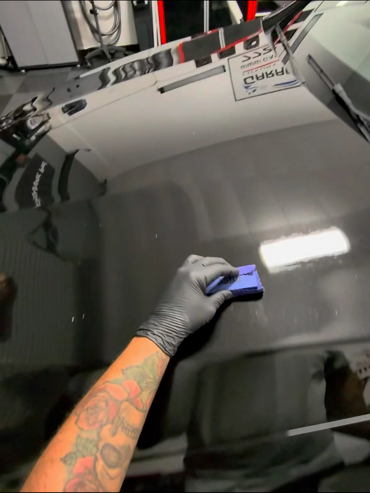 Ceramic coating being applied to prepared black paint