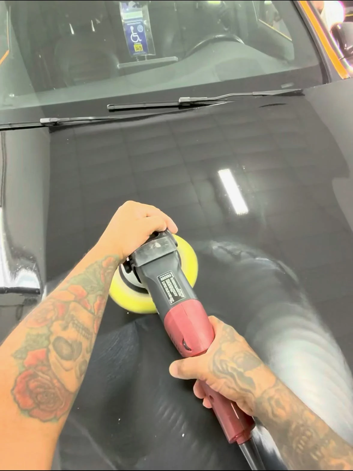 Polisher working defects on a black hood